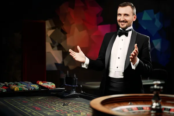 A glowing roulette wheel with cascading chips, symbolizing the engaging live and instant-win games available on 77HI.