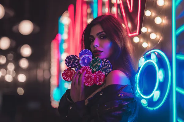 A woman in a luxurious green gown next to an ornate roulette wheel, capturing the upscale casino mood of 77HI.