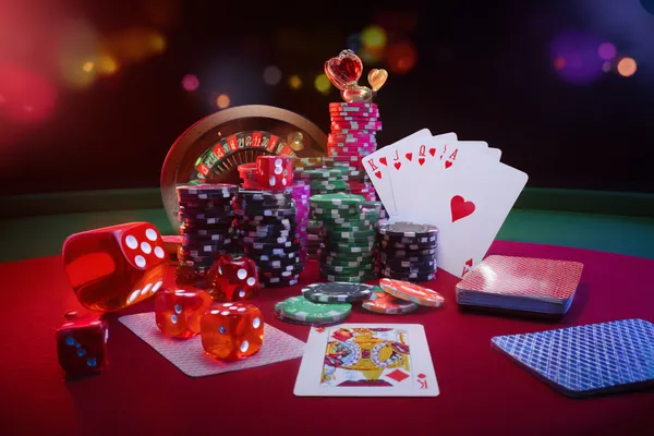 A player using their smartphone during a festive local event, representing 77HI’s fully mobile-friendly casino.