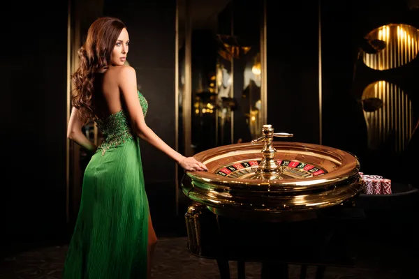 A person using their device against a moody casino-themed background, illustrating the smooth re-entry process at 77HI.
